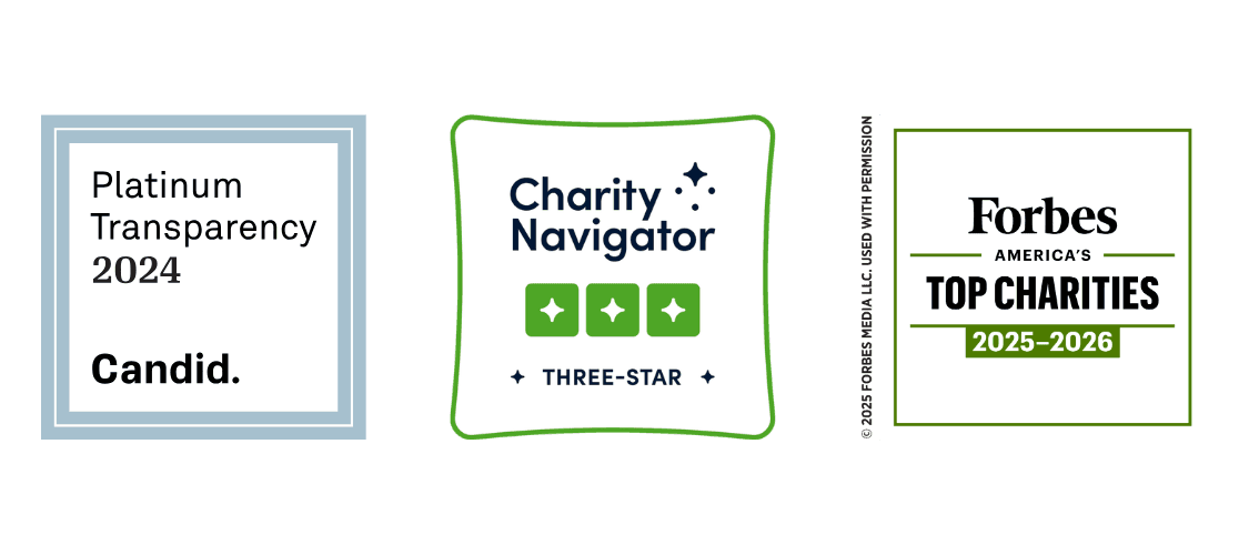 Badges from Candid (Platinun Transparency 2024), Charity Navigator (3 stars), and Forbes (America's Top Charities 2025-2026).